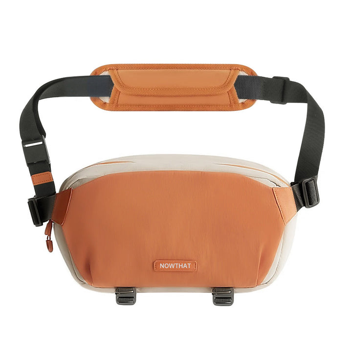 ARMOR-X Camera Sling Bag With Tripod Holder. Designed for photographers on the move, this sling bag features a flexible padded divider that holds one camera body, one lens, and essential accessories. Retract the divider to instantly convert it into a casual everyday sling.