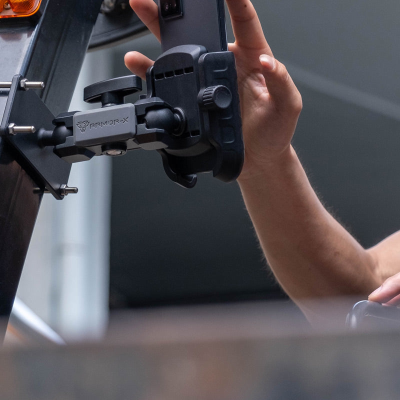 ARMOR-X Rugged iPhone Case and UNIVERSAL Car Mount installed in truck cabin for ELD use